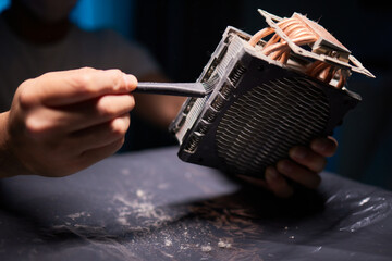 Cleaning a processor fan with a brush