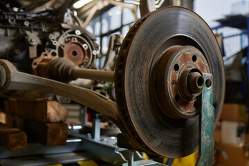 Closeup disassembled car automatic transmission gear part on workbench at garage or repair factory...