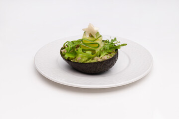 Cucumber, tuna and Avocado in an excellent presentation, served in an avocado peel. A festive touch...
