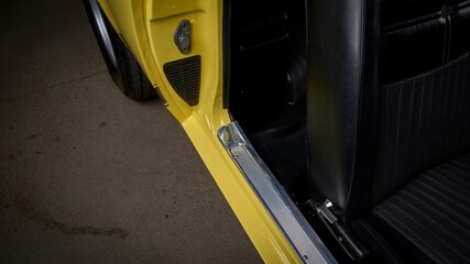 Passenger door sill on a yellow car
