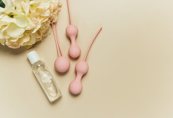 Pink balls and lubricant for special exercises for woman. Balls for intimate muscles of women....