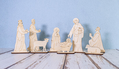 Nativity creche made of olive tree wood from the Holy Land with a Christmas tree and lights...