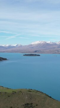 Orbital shot with a person from the top of Lake Taupo on a sunny day