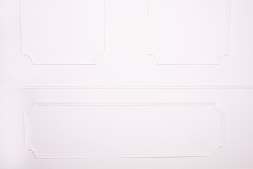 Decorative stucco on the classic background, white wall.
