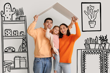 Happy family dreaming about their new house on light background