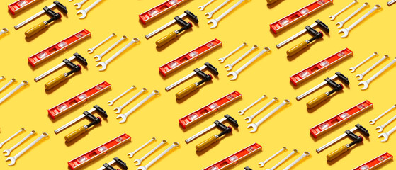 Set of construction supplies on yellow background. Pattern for design