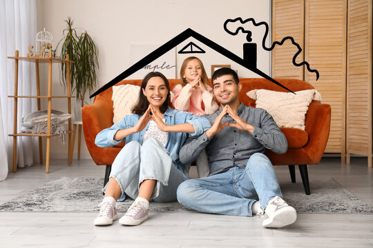 Happy family dreaming about their new house at home