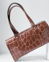 Close up of handmade brown embossed calfskin leather handbag, handmade leather bowler bag, artisan...