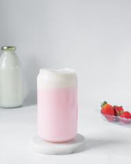 Pink latte with cream in a can shaped glass, strawberry raspberry latte in a glass shaped like a can, Aesthetic cafe pink latte in a can glass