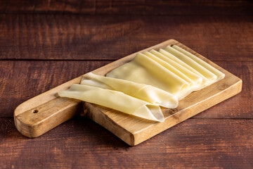 Cheese slices. Portion of sliced mozzarella cheese.