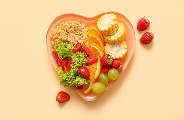 Plate with fresh healthy products on beige background. Diet concept