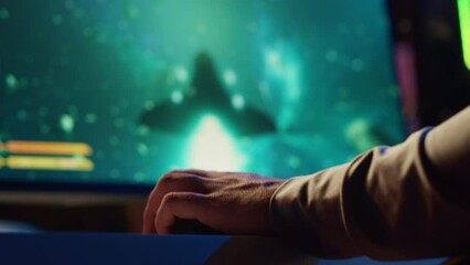 Man using gaming keyboard to play spaceship flying singleplayer game with overlay HUD showing health, fuel bars. Close up shot of gamer navigating with spacecraft in galaxy, shooting at asteroids