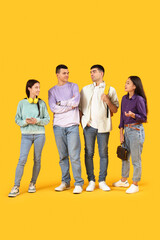Young people waiting in line on yellow background