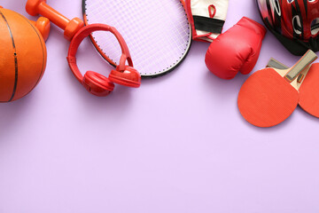 Composition with different sports equipment and headphones on color background