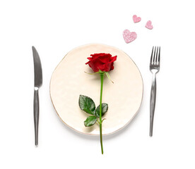 Beautiful table setting with red rose and hearts on white background. Valentine's Day celebration
