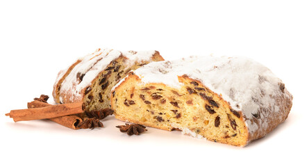 Tasty Christmas stollen with cinnamon and anise on white background
