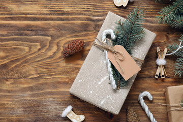 Composition with beautiful Christmas gifts, decor and fir branches on wooden background