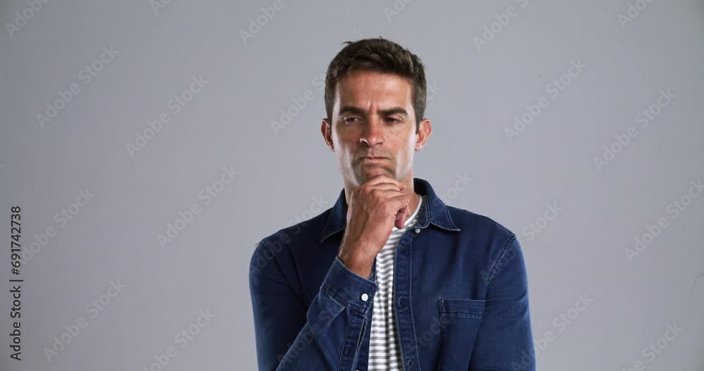 Aufkleber Man, thinking or doubt in studio portrait in confused, idea or frustrated by gray background. Person, face and decision with planning for problem solving, project insight and choice by mockup space