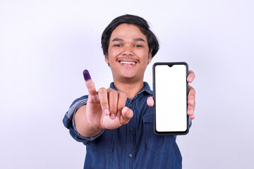 Asian man showing blank screen smart phone for mockup and finger after voting on Indonesia...