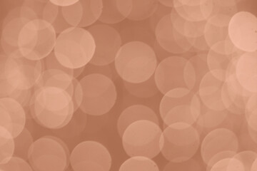 Peach Fuzz lights bokeh background, Chrismas lights bokeh. Monochrome abstract background. Blurred and glowing lights. Classic blue bokeh lens effect from lighting spots.