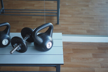 Gym Equipment or Dumbbell Kettlebell in a gym bench 