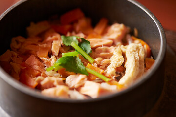 Stone pot rice with fish and vegetables