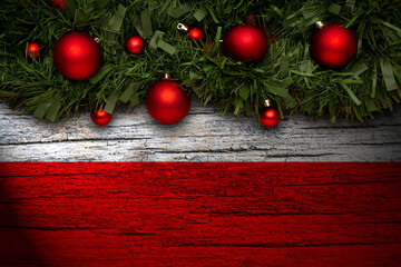 Christmas background made with garlands on a poland flag background. Christmas greeting from poland.