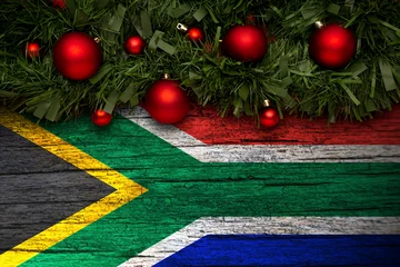 Fotobehang Afrika Christmas background made with garlands on a south africa flag background. Christmas greeting from south africa  © Hapelinium