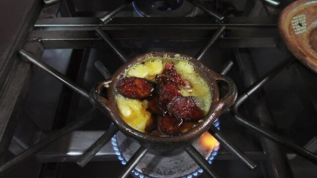 Moment captured in a Mexican restaurant, with melted cheese and chorizo as protagonists of this delicious culinary tradition.Traditional Mexican food concept.