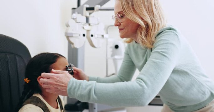 Eye exam, optometry and optician with frame for child for testing vision, sight and glasses for eyes. Healthcare, medical equipment and young patient with woman for prescription lens in clinic