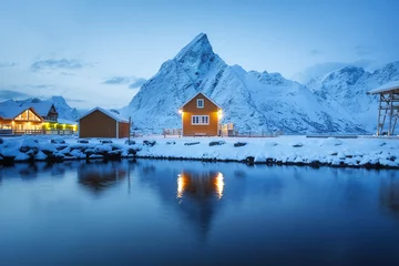 Fotobehang Reinefjorden View on the house in the Sarkisoy village, Lofoten Islands, Norway. Landscape in winter time during blue hour. Mountains and water. Travel - image