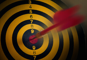dart hitting target , business target , marketing goal