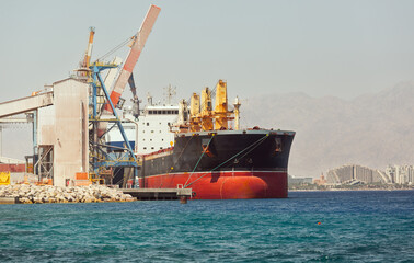  cargo ship in the port of the Gulf of Eilat - Powered by Adobe