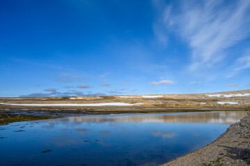 Obraz premium Glacial melt lake at Kinnvika, Murchison Fjord, Hinlopen Straight on Svalbard in the Arctic, as a nature background 