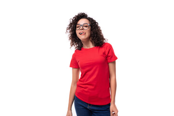 young caucasian active leader woman with black curly hair dressed in red t-shirt with fabric print mockup