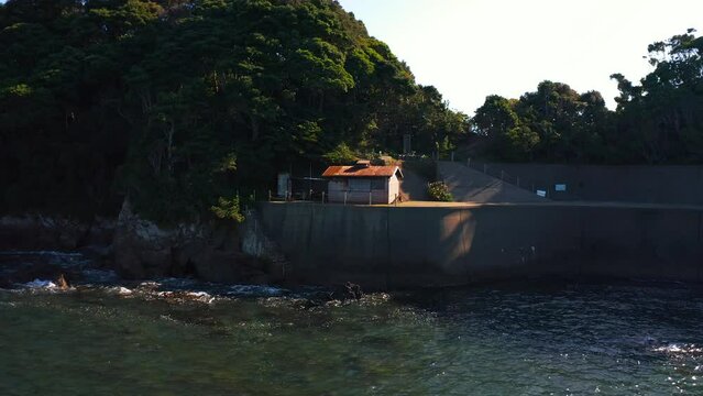 Ama Diver Hut in Osatsu Japan, Wide Pan Shot of Coastal House