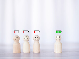 Wooden human figure with status of battery icons.