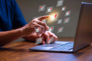 E-commerce and Online shopping concept,  Man using laptop computer with shopping cart icon for...