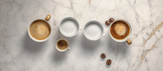 Four cups filled with coffee were neatly arranged side by side on the marble table