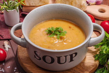 Chickpea-tomato cream soup with fragrant garlic buns. Comfort food, nostalgic mood concept