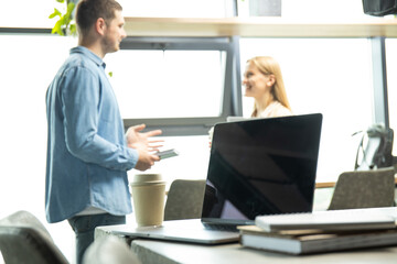Close-up of a laptop near a cup of coffee on a table
