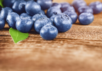 blueberries are scattered on the table, a place for text