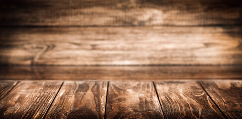 Wooden table in front of a wooden wall with a place to present the product
