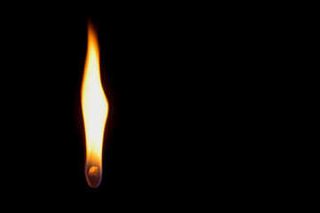 Candle flame with exploding flammable liquid sprayed onto flame creating unique patterns and shapes