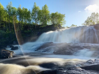 Waterfall in the forest near Murmansk, Russia, June 2019