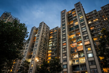 Fototapeta na wymiar Evening Windows of Residential Buildings in Hong Kong
