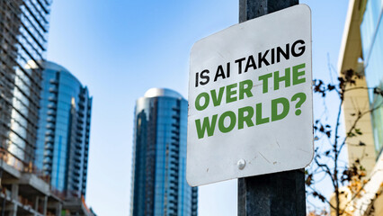 Is AI Taking Over The World? on a sign in a city business district