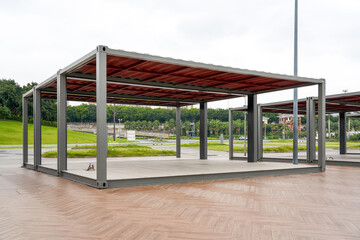 Metal support tent for commercial stalls outdoors in the park