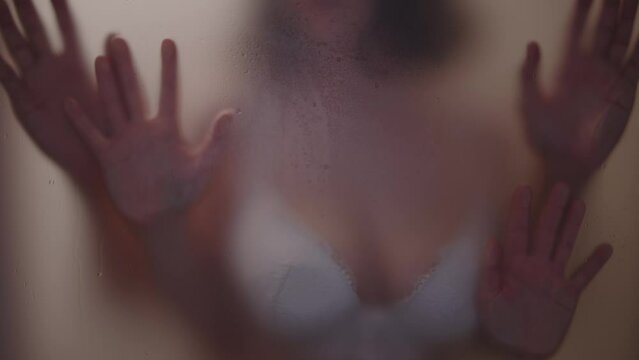 Young couple sexual bonding against a steamy mirror