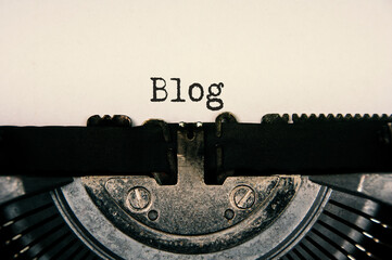 Blog text on an old vintage typewriter. Online business concept